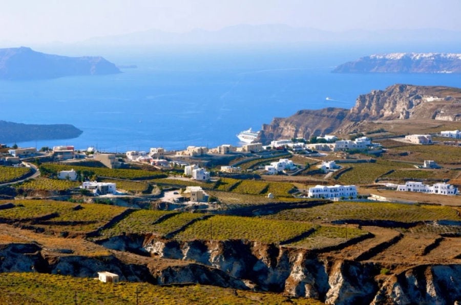 White houses perched on cliffs, overlooking the azure sea. A picturesque paradise, where dreams come alive